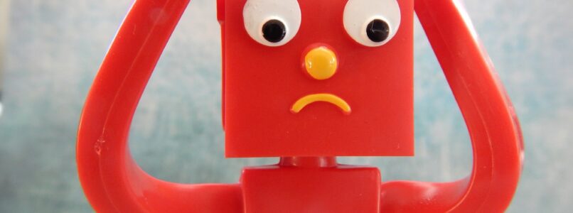 Gumby with hands reaching up next to his head in frustration