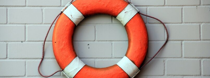 life preserver hanging on tile wall