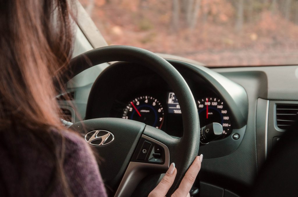 Woman driving car for ridesharing activities