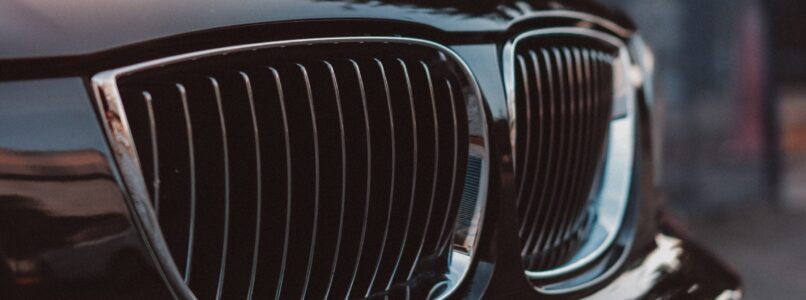 importance of having enough auto liability insurance - front end of black BMW